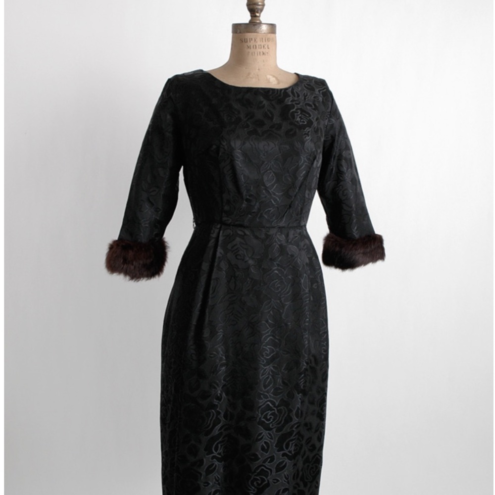 1960’s black cocktail satin dress with rabbit fur cuffs. Size 5, back zipper